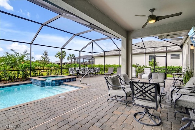 17641 Brooksin Ct, Estero, FL 33928 - view of swimming pool featuring glass enclosure, ceiling fan, a patio, and an outdoor hangout area