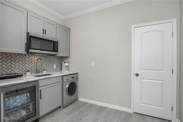 17641 Brooksin Ct, Estero, FL 33928 - kitchen with sink, beverage cooler, washer / clothes dryer, crown molding, and gray cabinets