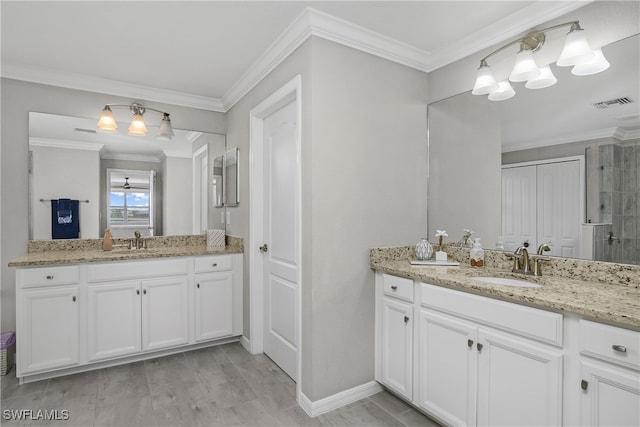 bathroom with crown molding, vanity, and wood-type flooring