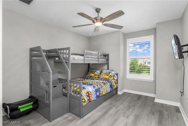 bedroom featuring light hardwood / wood-style floors and ceiling fan