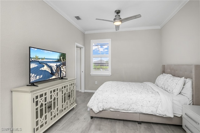 bedroom with ceiling fan, ornamental molding, and light hardwood / wood-style flooring