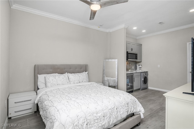 bedroom featuring washer / clothes dryer, wine cooler, ceiling fan, and crown molding