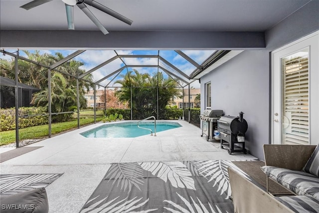 view of pool with a patio area, a grill, ceiling fan, and glass enclosure