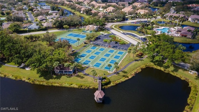drone / aerial view with a water view and a residential view