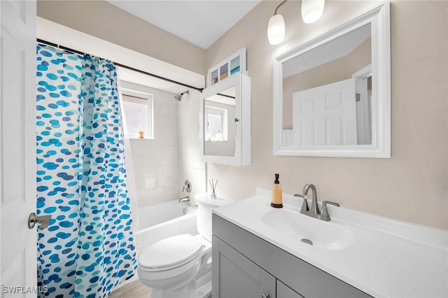 bathroom with shower / bath combo with shower curtain, vanity, and toilet