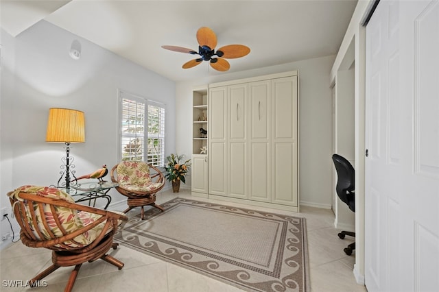 interior space featuring light tile patterned flooring and ceiling fan