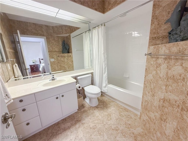 full bathroom with toilet, vanity, and shower / bathtub combination with curtain