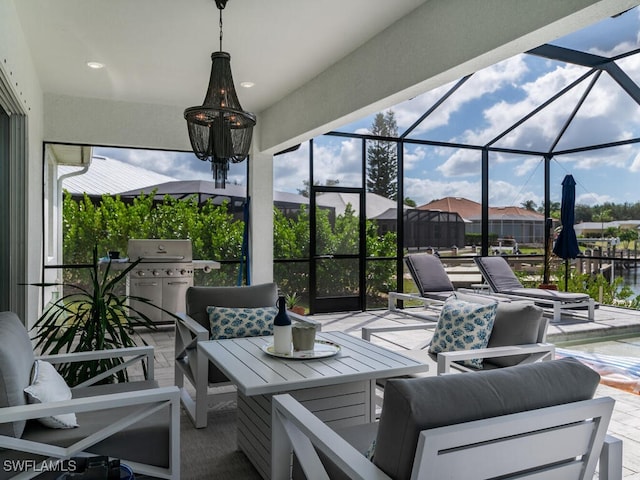 view of patio featuring an outdoor hangout area, area for grilling, and glass enclosure