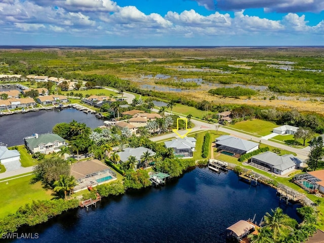 birds eye view of property featuring a water view