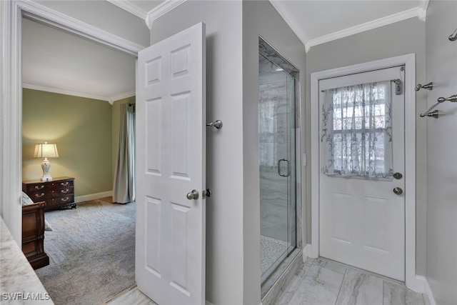 full bath with a stall shower, baseboards, marble finish floor, and crown molding