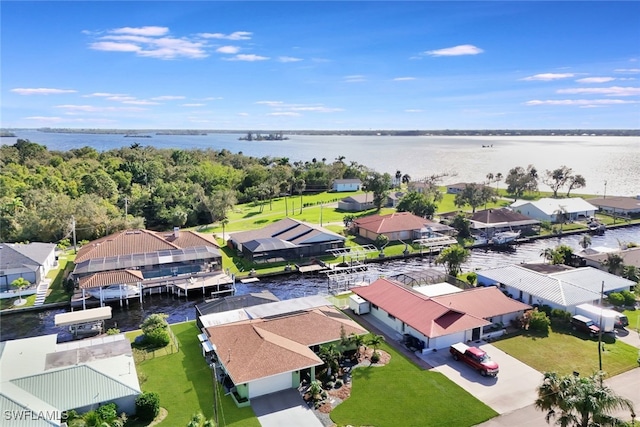 bird's eye view featuring a water view and a residential view