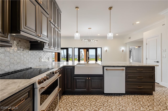 kitchen featuring hanging light fixtures, kitchen peninsula, sink, crown molding, and appliances with stainless steel finishes