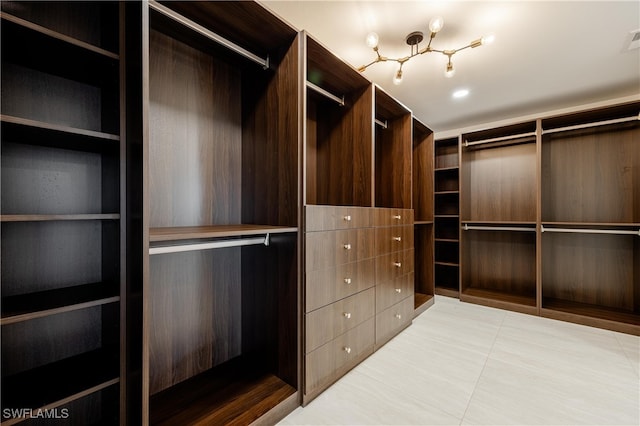 spacious closet featuring light tile patterned floors