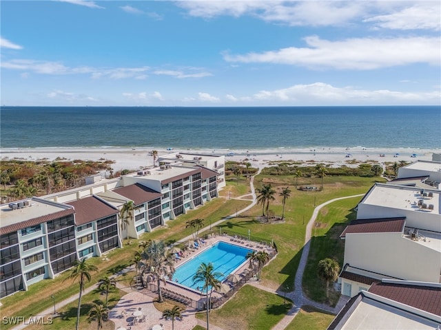 bird's eye view featuring a view of the beach and a water view