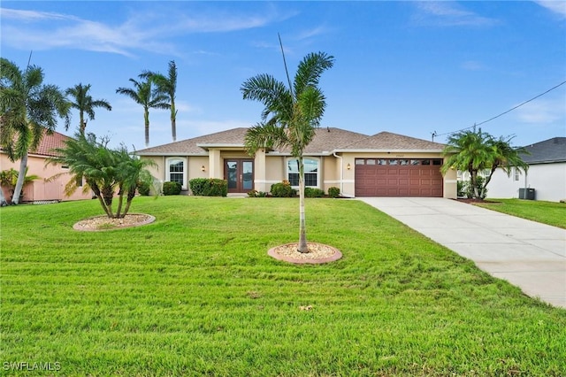 single story home featuring central AC unit, a front lawn, a garage, and french doors