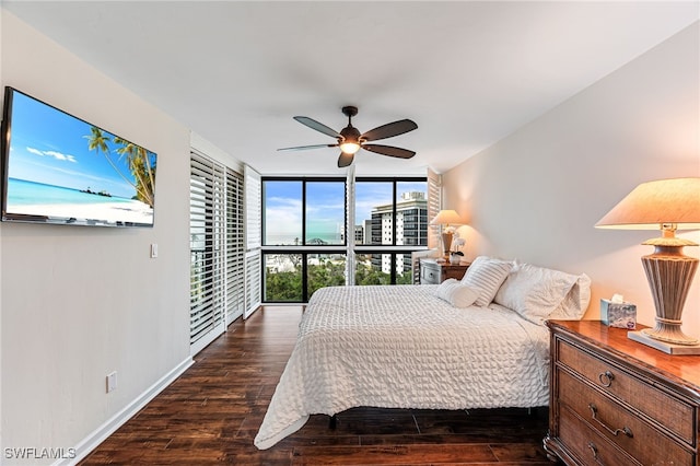 bedroom featuring a wall of windows, ceiling fan, and dark hardwood / wood-style flooring