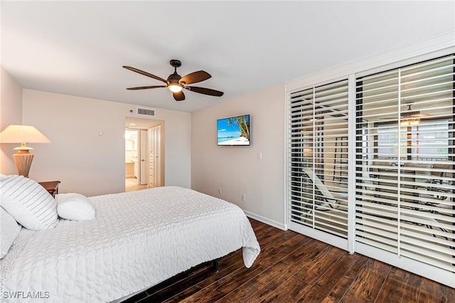 bedroom with dark hardwood / wood-style floors and ceiling fan