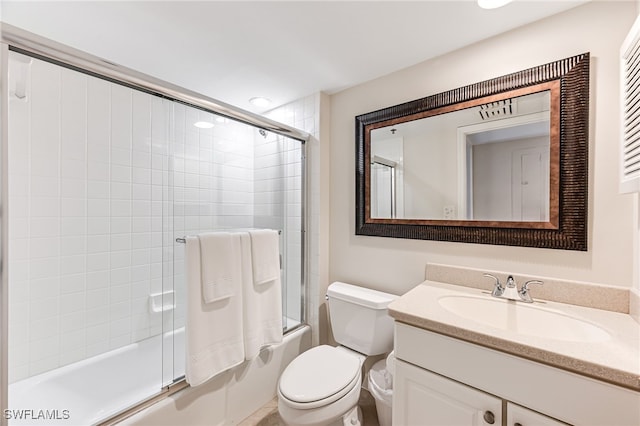 full bathroom with vanity, toilet, and enclosed tub / shower combo