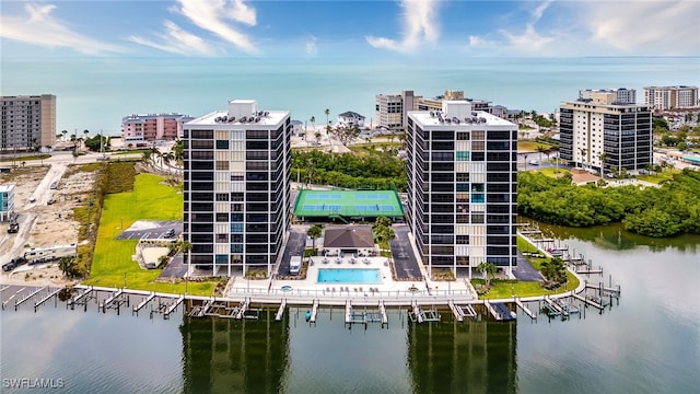 birds eye view of property with a water view