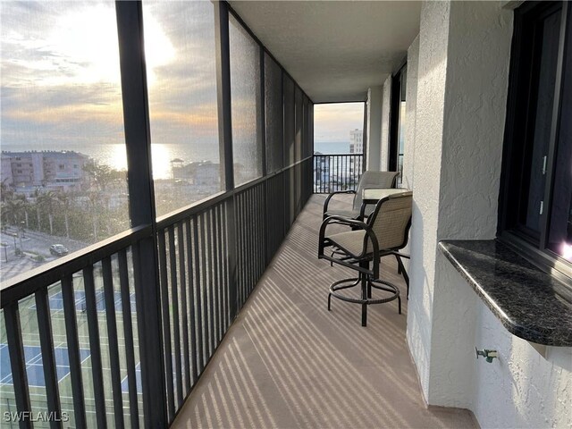 view of balcony at dusk