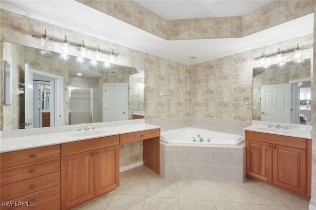 bathroom with vanity, independent shower and bath, and tile patterned floors