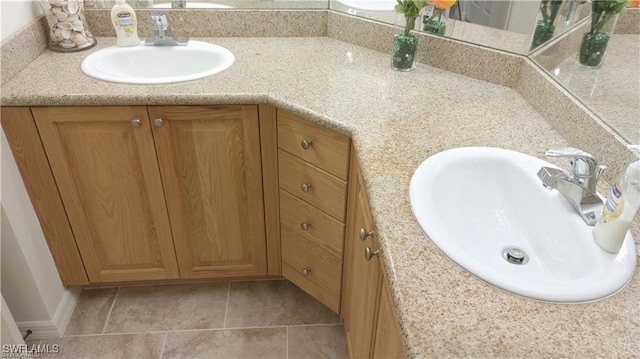 bathroom with vanity and tile patterned floors