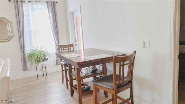 dining room with light wood-type flooring