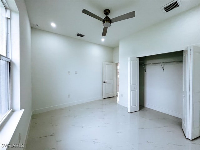 unfurnished bedroom with a closet and ceiling fan