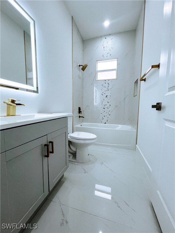 full bathroom with vanity, tiled shower / bath combo, and toilet