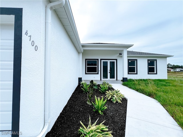 doorway to property featuring a garage