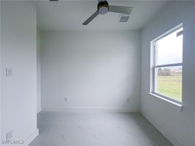 unfurnished room featuring ceiling fan