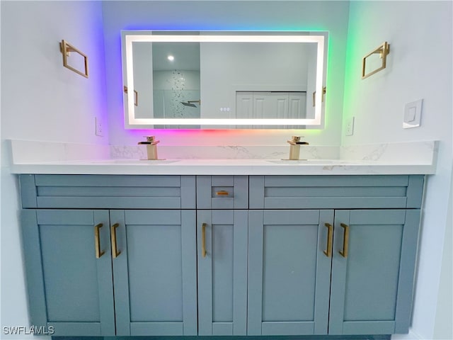 bathroom with vanity and a shower with door