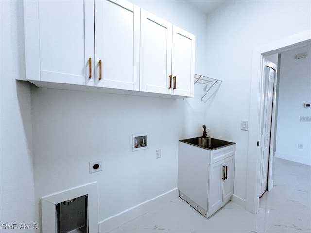 clothes washing area featuring hookup for a washing machine, electric dryer hookup, cabinets, and sink