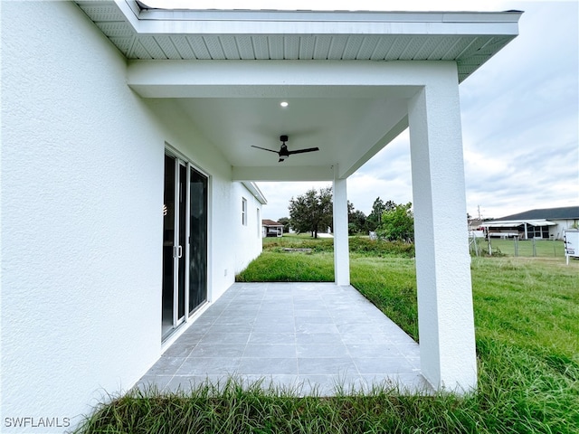 view of patio with ceiling fan