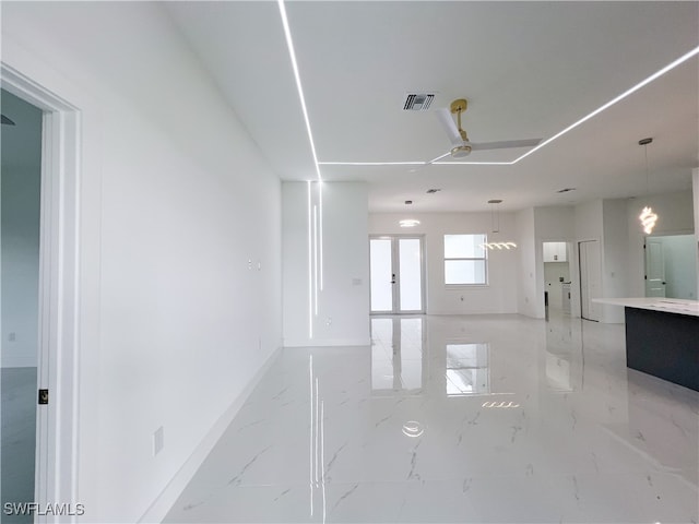 empty room with french doors and ceiling fan