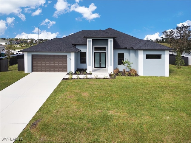 prairie-style house with a front lawn and a garage