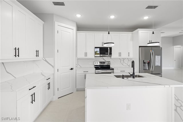 kitchen with appliances with stainless steel finishes, sink, and white cabinets