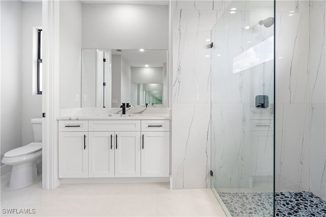 bathroom with toilet, an enclosed shower, vanity, and tile patterned floors