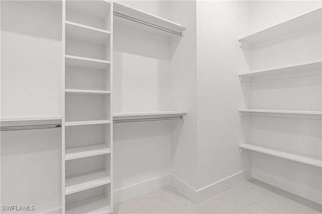 walk in closet featuring light tile patterned floors