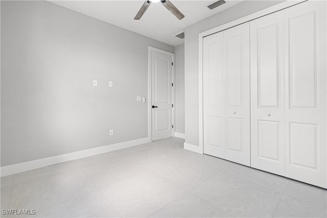 unfurnished bedroom featuring a closet and ceiling fan