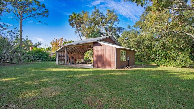 view of outdoor structure with a yard