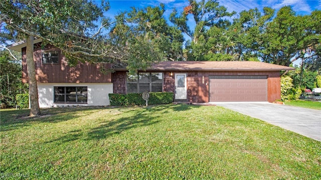 tri-level home with a front lawn and a garage