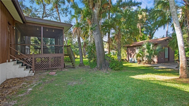 view of yard with a sunroom