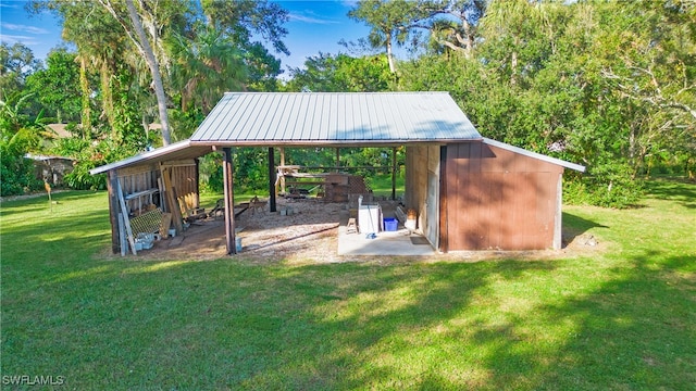 view of outdoor structure with a lawn