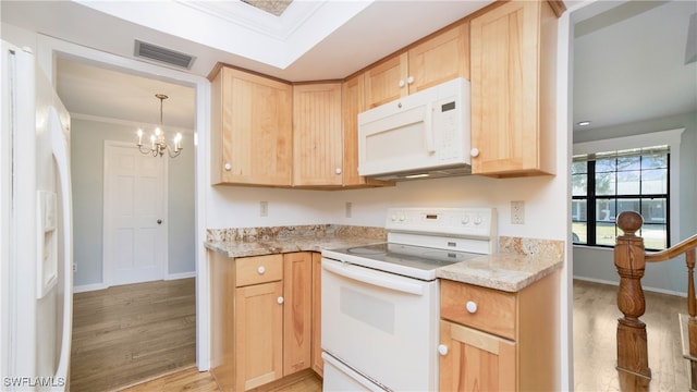 kitchen with light brown cabinets, white appliances, light hardwood / wood-style flooring, and crown molding