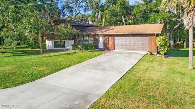 view of front of home featuring a front yard and a garage