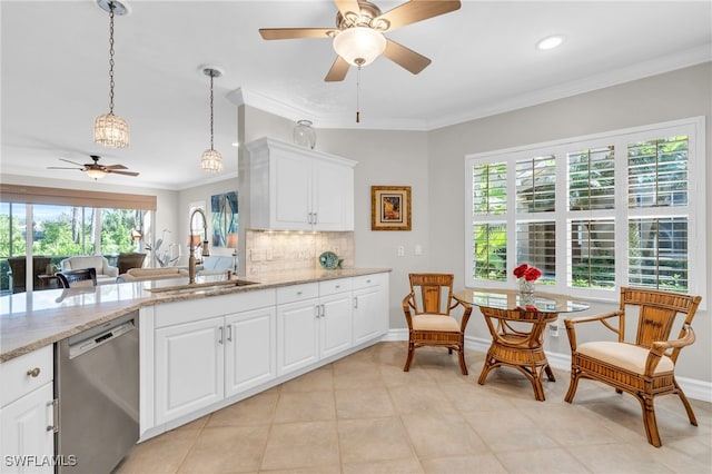 kitchen featuring sink, white cabinetry, dishwasher, and a wealth of natural light