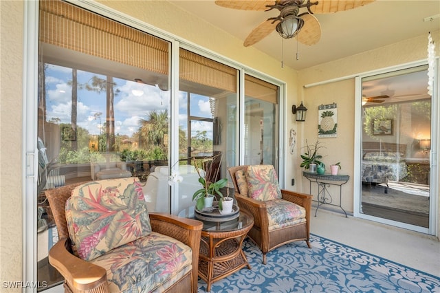 sunroom featuring a wealth of natural light and ceiling fan