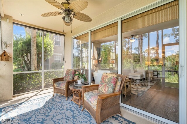 sunroom / solarium with ceiling fan