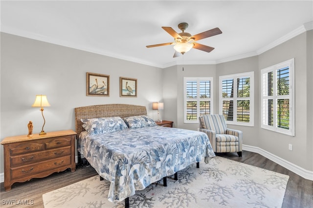 bedroom featuring ceiling fan, crown molding, and wood-type flooring